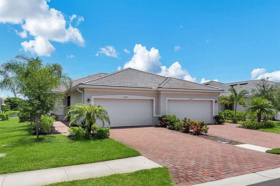 Front exterior of a new home in , Naples, FL, highlighting curb appeal (Image 1). Front exterior of a new home in , Naples, FL, highlighting curb appeal (Image 1).