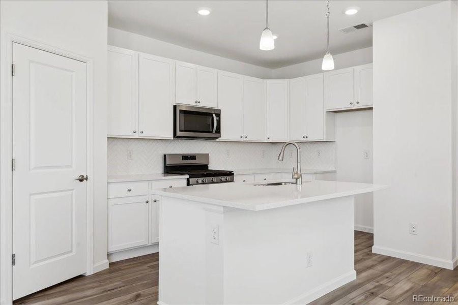 Furnished interior view inside a new home in Pacific Collection at The Townes at Skyline Ridge, Castle Pines (Image 5).