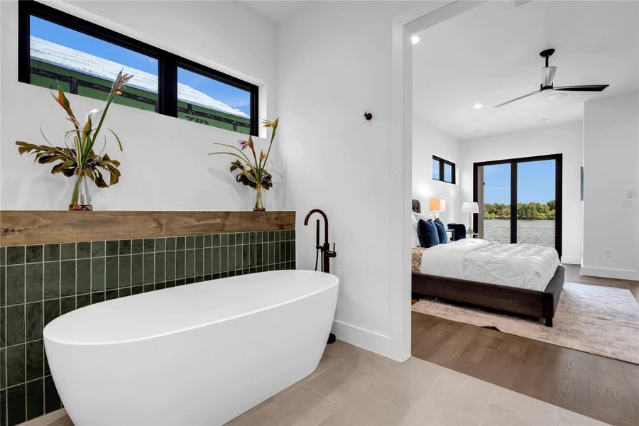 Bathroom with a freestanding bath, tile patterned floors, recessed lighting, ensuite bath, and a ceiling fan