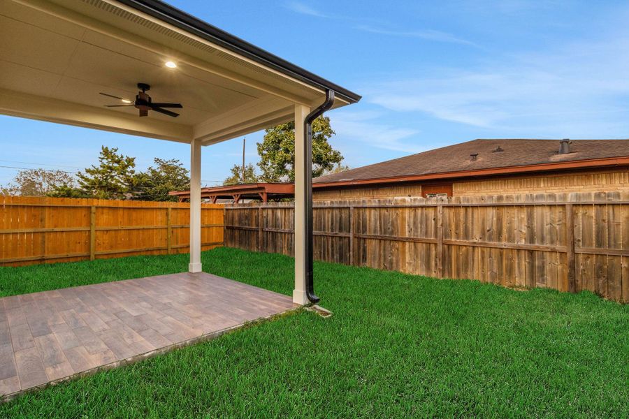 Enjoy year-round comfort on the covered patio complete with ceiling fan and tile flooring. Enjoy year-round comfort on the covered patio complete with ceiling fan and tile flooring.