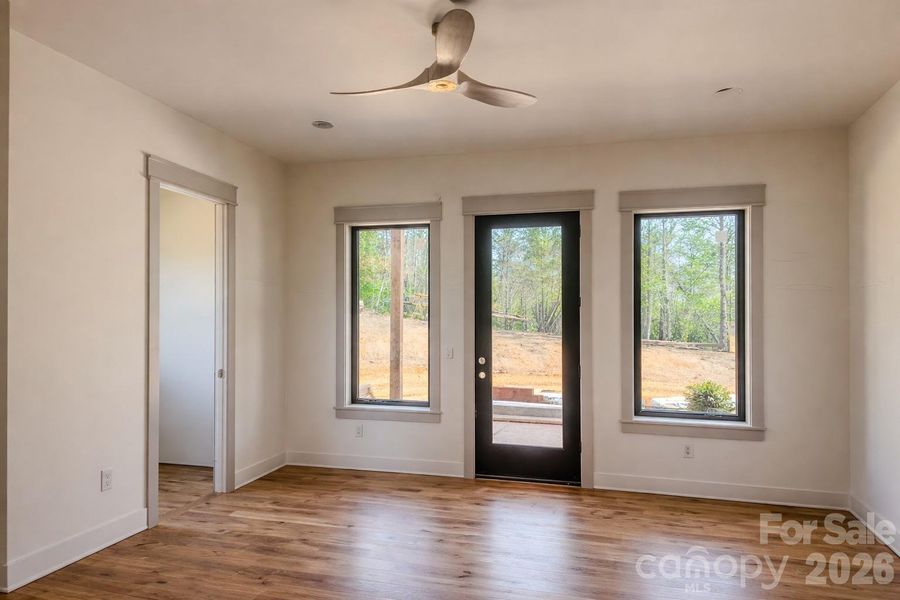 Primary Suite with private access to screened outdoor deck.