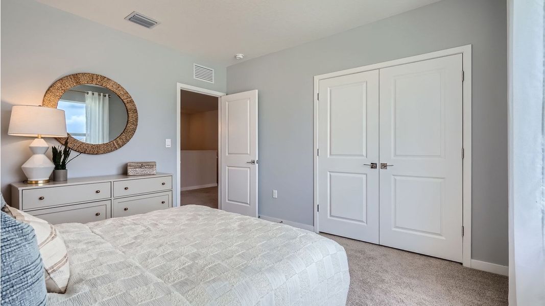 Representative furnished interior of a home built from the Grandcourt by D.R. Horton in Parker Pointe, Homestead (Image 25).