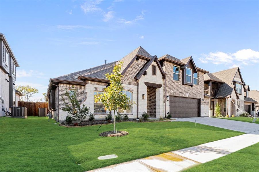 Front exterior of a new home in Bear Creek Classic 60, Lavon, TX, highlighting curb appeal (Image 22). Front exterior of a new home in Bear Creek Classic 60, Lavon, TX, highlighting curb appeal (Image 22).
