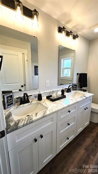 Main Bath with dual marble vanities.