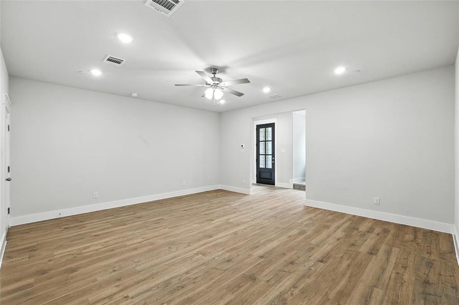 Unfurnished room with recessed lighting, light wood-type flooring, and ceiling fan