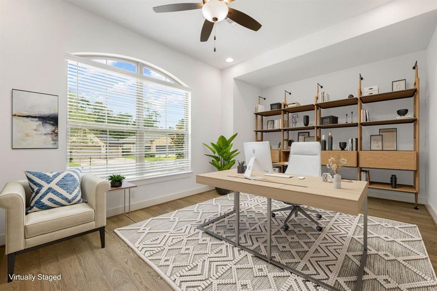 Nestled away quietly in the front of the home is the handsome and grand home office, or additional bedroom. Featuring high ceilings, ceiling fan, neutral paint, engineered wood flooring, recessed lighting and large windows with privacy blinds.