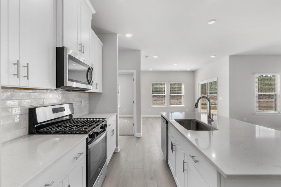 Furnished interior view inside a new home in Waterside - Coastline Series, Longs (Image 12).