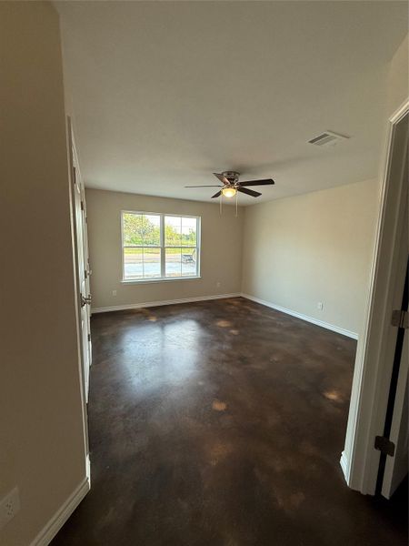 Spare room with concrete floors and ceiling fan Spare room with concrete floors and ceiling fan