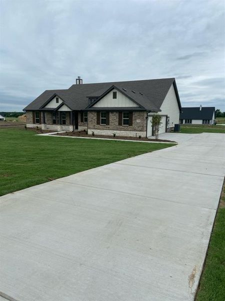 Front exterior of a new home in Hillview Addition, Decatur, TX, highlighting curb appeal (Image 11).