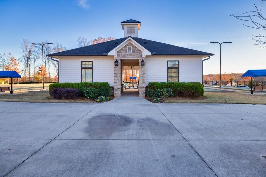 Front exterior of a new home in Del Webb Chateau Elan, Hoschton, GA, highlighting curb appeal (Image 16).