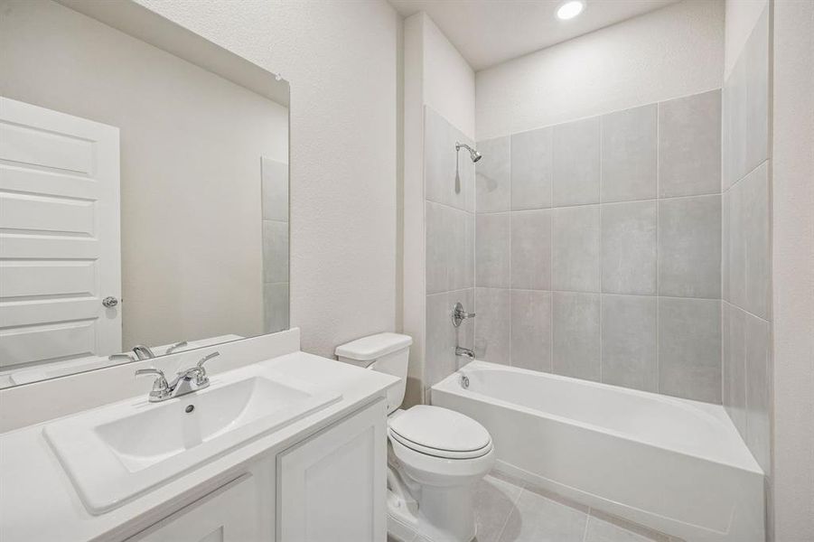 Bathroom in the Wimbledon home plan by Trophy Signature Homes – REPRESENTATIVE PHOTO
