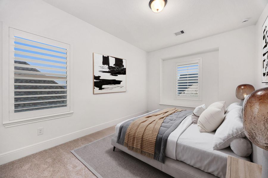 A well-sized secondary bedroom offering a comfortable layout and a light-filled feel.