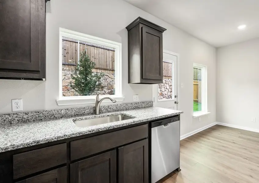 The window in the kitchen lets in great, natural light and backyard views. The window in the kitchen lets in great, natural light and backyard views.