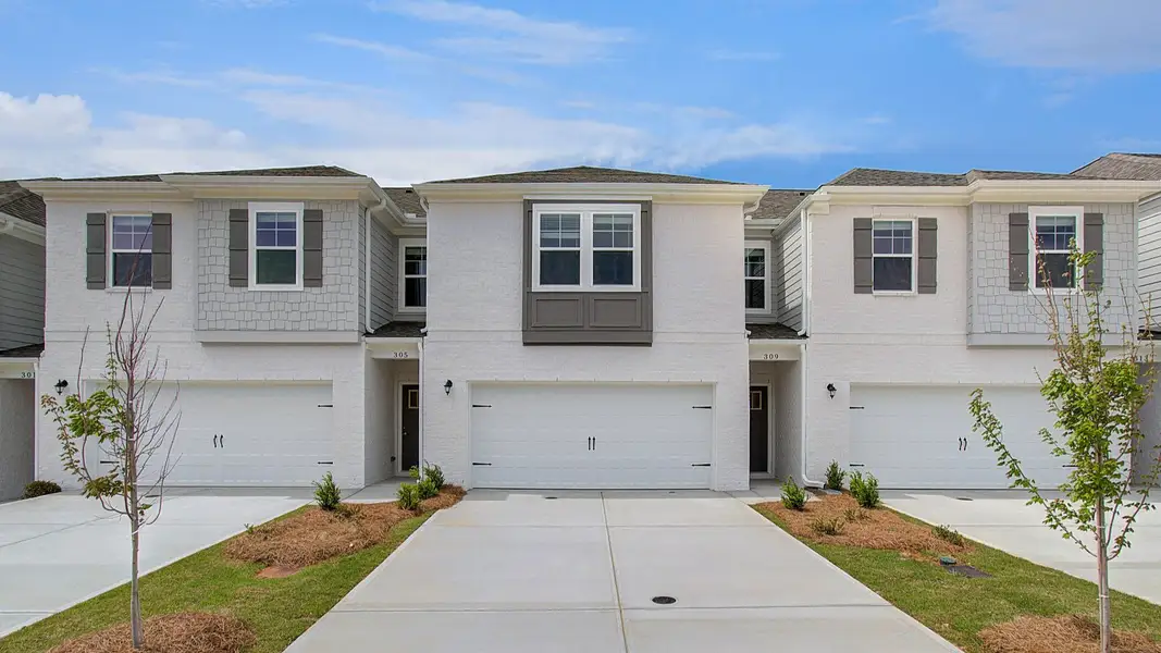 Front exterior of a new home in Bowers Farm Townhomes, McDonough, GA, highlighting curb appeal (Image 2). Front exterior of a new home in Bowers Farm Townhomes, McDonough, GA, highlighting curb appeal (Image 2).