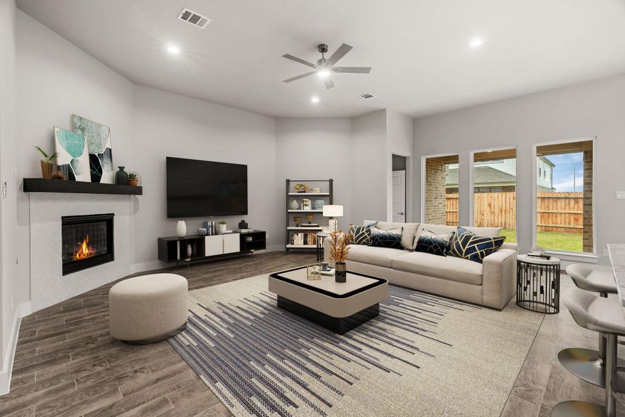 Bring the family and guests together in the welcoming family room! Enjoy the expansive space adorned with high ceilings, recessed lighting, a stylish ceiling fan, custom paint, exquisite flooring, and generously sized windows that fill the room with an abundance of natural light, creating a warm and inviting atmosphere for everyone to enjoy. . Sample photo of completed home with similar floor plan. As-built interior colors and selections may vary. Bring the family and guests together in the welcoming family room! Enjoy the expansive space adorned with high ceilings, recessed lighting, a stylish ceiling fan, custom paint, exquisite flooring, and generously sized windows that fill the room with an abundance of natural light, creating a warm and inviting atmosphere for everyone to enjoy. . Sample photo of completed home with similar floor plan. As-built interior colors and selections may vary.