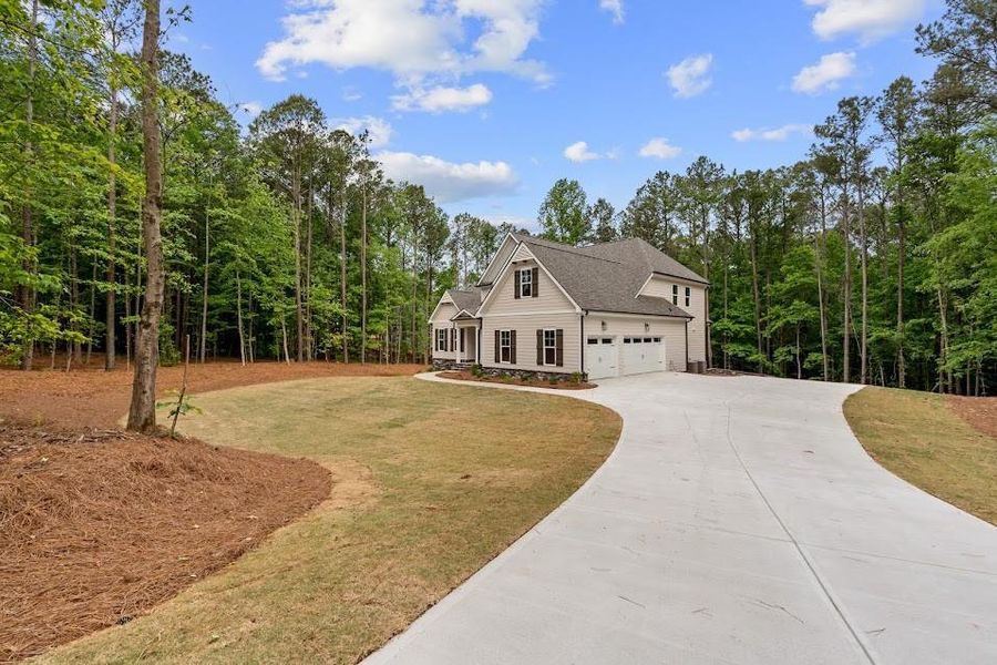 Front exterior of a new home in , Winston, GA, highlighting curb appeal (Image 2). Front exterior of a new home in , Winston, GA, highlighting curb appeal (Image 2).