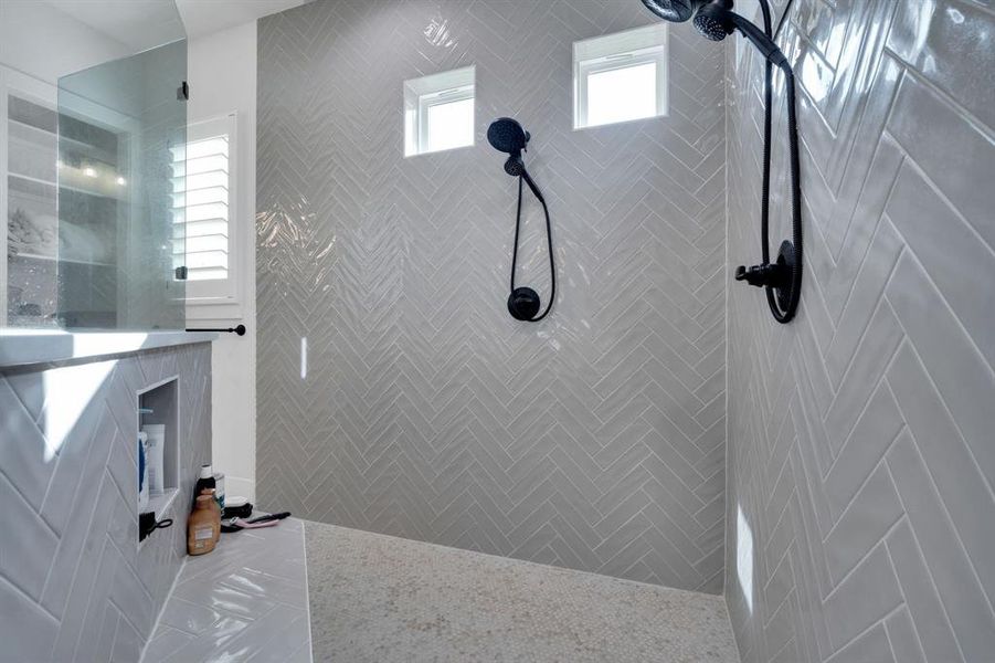 Oversized shower with bench and double shower heads with sprayers!