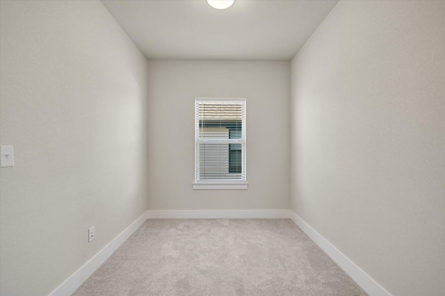 Plush carpeting and a single centered window define this versatile alcove space. Plush carpeting and a single centered window define this versatile alcove space.