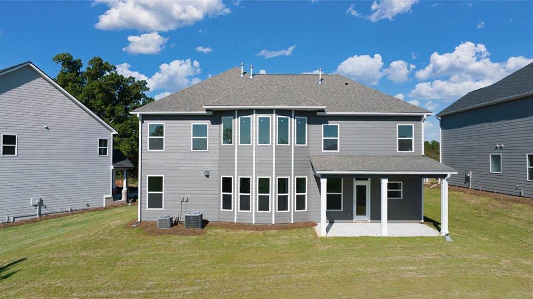 Exterior details and patio area of a home in Evergreen Crossing, Locust Grove (Image 2).