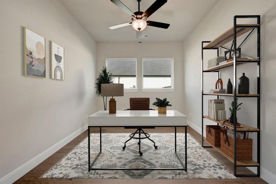 Home office with a ceiling fan and dark wood-type flooring Home office with a ceiling fan and dark wood-type flooring