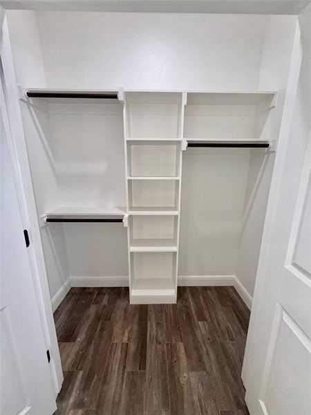 Bedrooms 2 and 3 feature similiar built in closets, spacious walk in  style with built in shelves and multiple hanging rods.