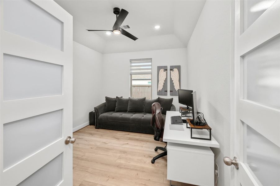 Large private home office with upgraded double doors.
