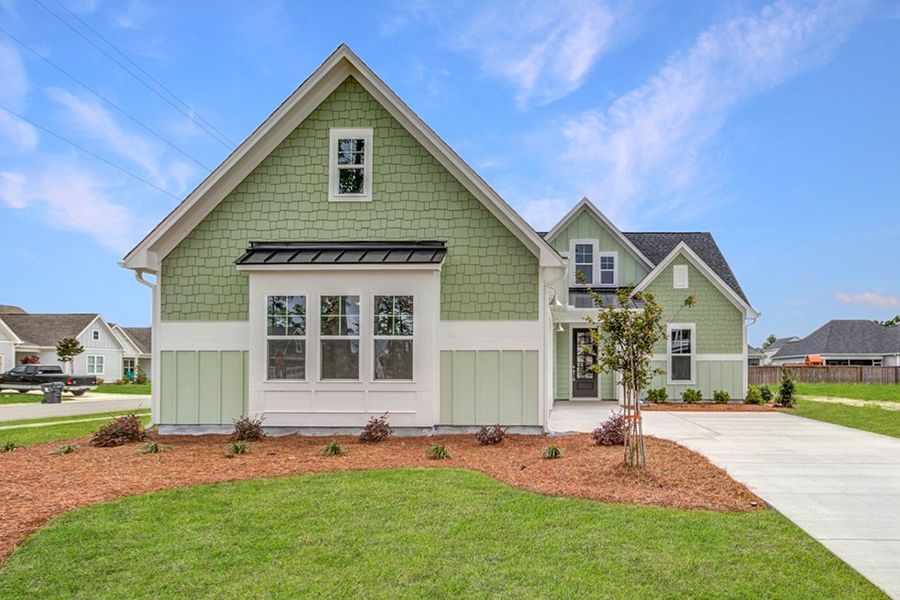 Representative exterior photo of a completed home built from the The Amherst by RobuckHomes in Windwater, Hampstead, NC (Image 29).