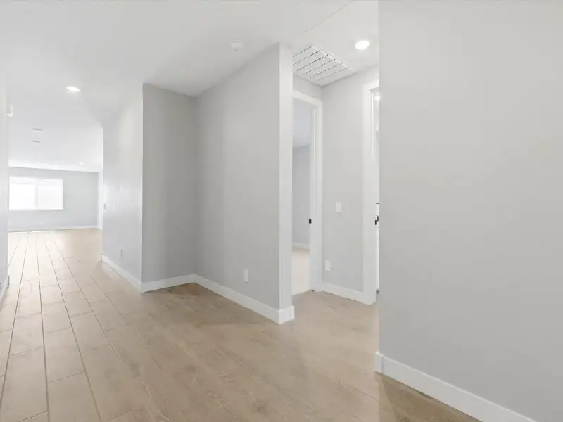 Spacious, unfurnished interior of a new home in Blossom Rock Reserve Series, Apache Junction (Image 14).