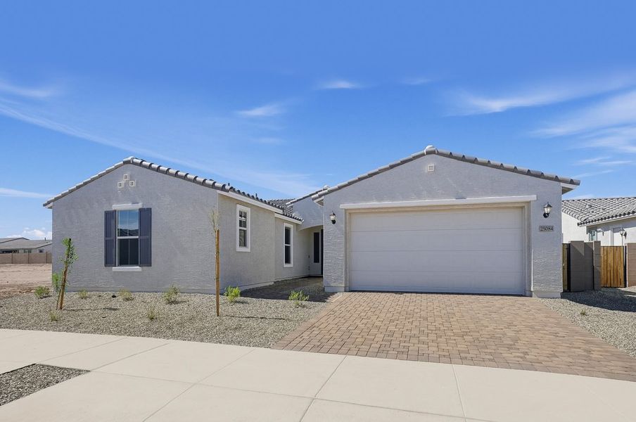 Front exterior of a new home in Artisan at Asante, Surprise, AZ, highlighting curb appeal (Image 17).