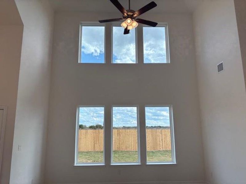 Unfurnished living room featuring ceiling fan Unfurnished living room featuring ceiling fan