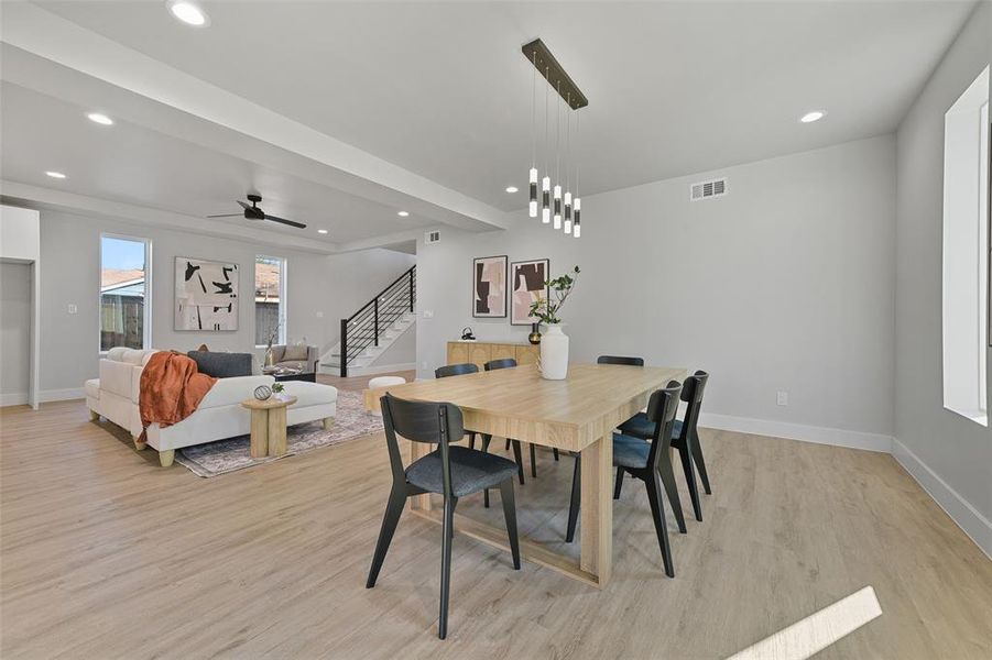 Dining space featuring light wood-type flooring and ceiling fan