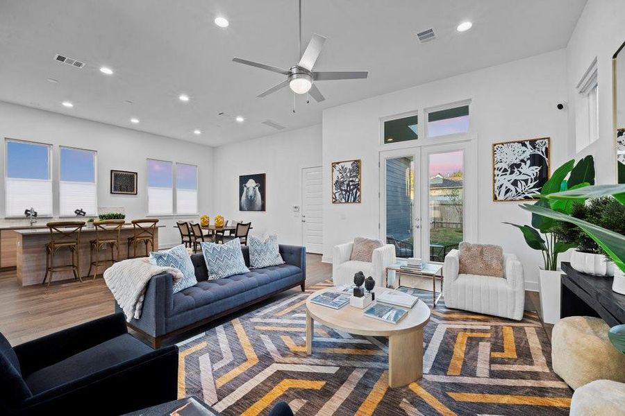 Living room featuring recessed lighting, wood finished floors, and a ceiling fan