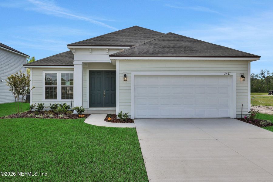 Front exterior of a new home in Jennings Farm, Middleburg, FL, highlighting curb appeal (Image 23).
