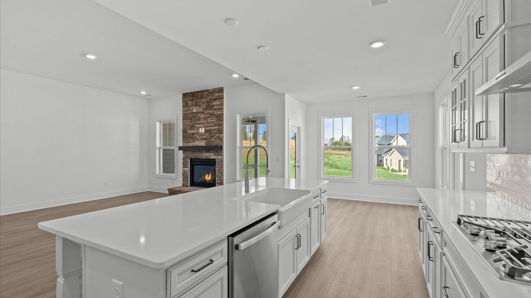 Superior kitchen with quartz countertops and a generously sized island