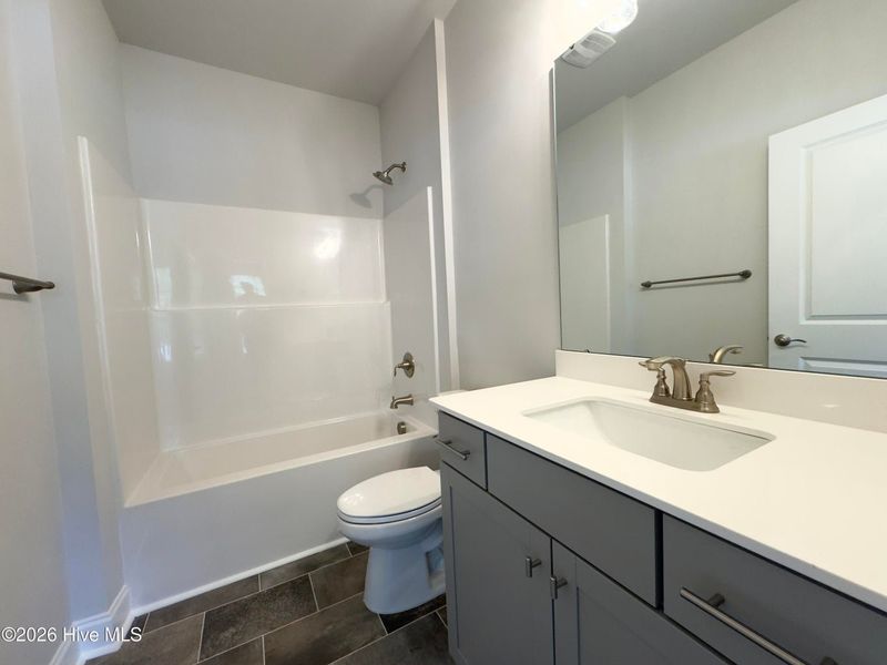 Furnished interior view inside a new home in East Lake, Leland (Image 9).