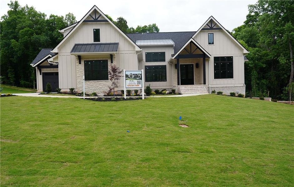 Front exterior of a new home in , Conyers, GA, highlighting curb appeal (Image 2). Front exterior of a new home in , Conyers, GA, highlighting curb appeal (Image 2).