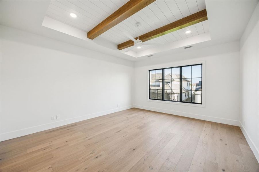 Unfurnished room with a wood ceiling with exposed beams, light wood finished floors, ceiling fan, and recessed lighting Unfurnished room with a wood ceiling with exposed beams, light wood finished floors, ceiling fan, and recessed lighting