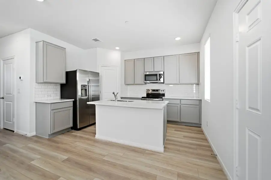 Furnished interior view inside a new home in Municipal Drive Townhomes, Leander (Image 13). Furnished interior view inside a new home in Municipal Drive Townhomes, Leander (Image 13).