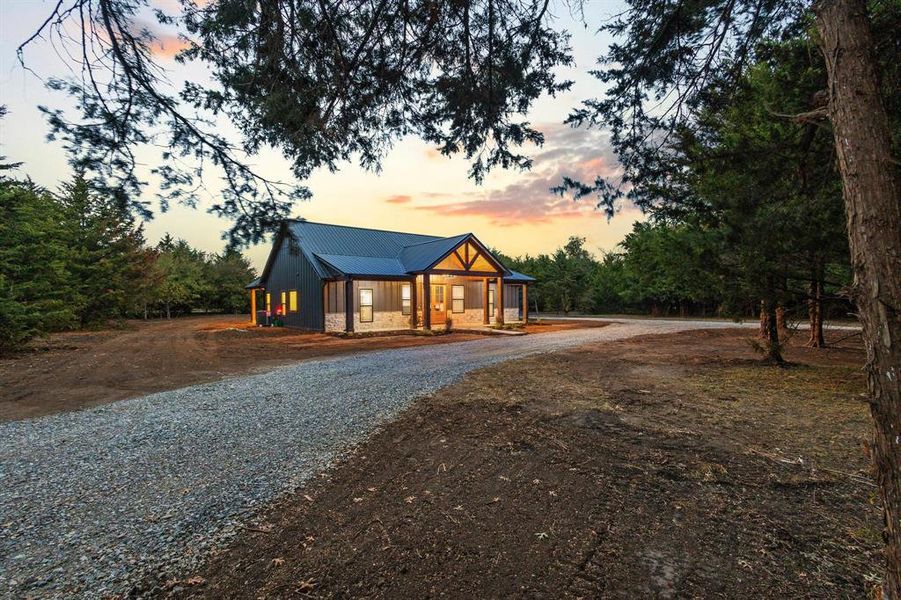 Front exterior of a new home in , Bonham, TX, highlighting curb appeal (Image 25).