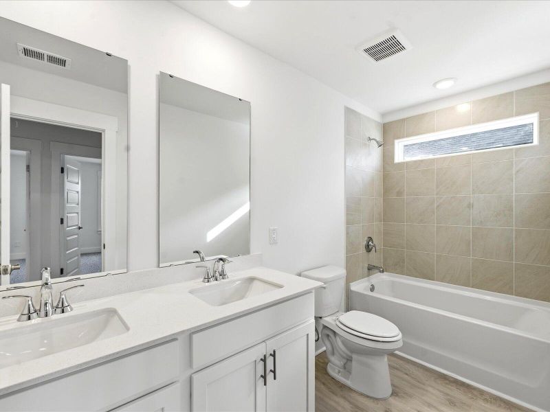 Furnished interior view inside a new home in The Coves at Lakes of Cane Bay II, Summerville (Image 28).
