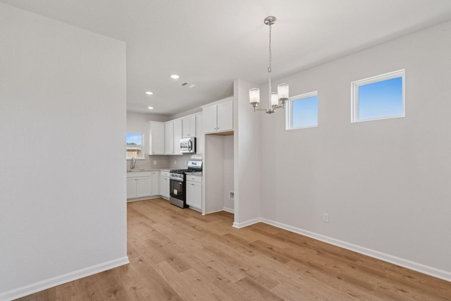 The Blue Jay II- Family Room into the Breakfast Area. Home under construction. Sample floor plan photo used for illustrative purposes only. Upgrades, selections options, windows and colors may vary. The Blue Jay II- Family Room into the Breakfast Area. Home under construction. Sample floor plan photo used for illustrative purposes only. Upgrades, selections options, windows and colors may vary.