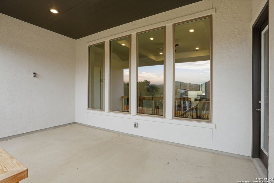 Exterior details and patio area of a home in Kinder Ranch - 70', San Antonio (Image 28).