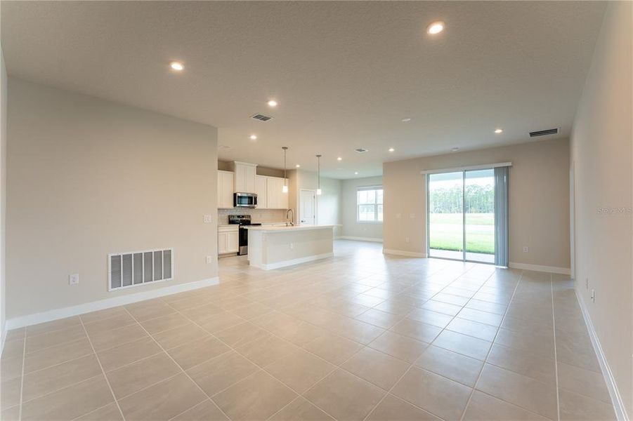 Spacious, unfurnished interior of a new home in The Palms at Venetian Bay, New Smyrna Beach (Image 14).
