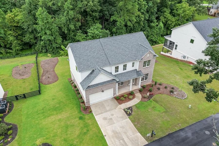 Front exterior of a new home in , Sugar Hill, GA, highlighting curb appeal (Image 24). Front exterior of a new home in , Sugar Hill, GA, highlighting curb appeal (Image 24).