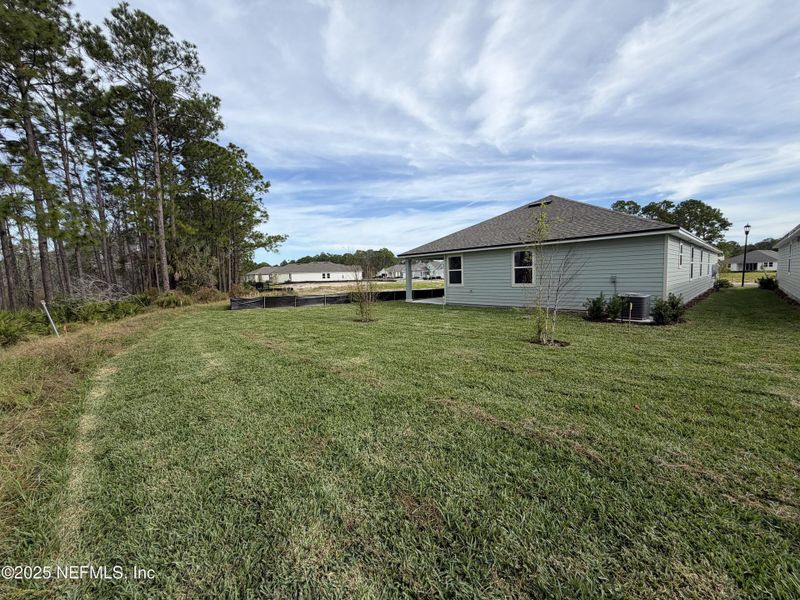 Exterior details and patio area of a home in The Magnolia Series at Reserve East, Flagler Beach (Image 4).