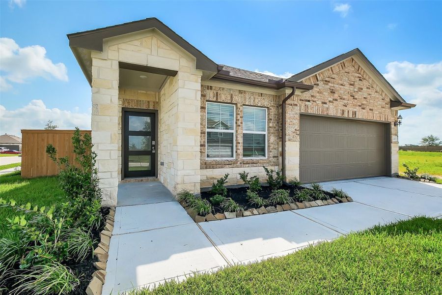 Front exterior of a new home in Emberly, Beasley, TX, highlighting curb appeal (Image 44).