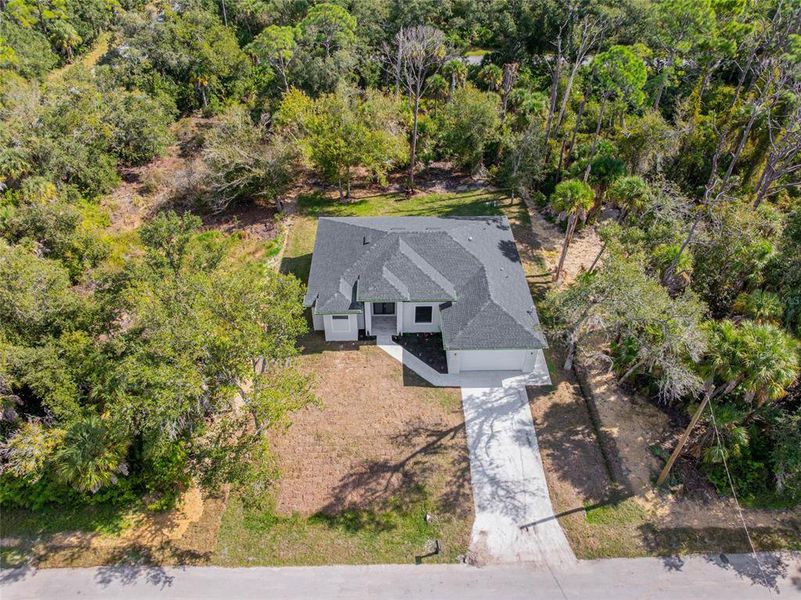 Front exterior of a new home in , Port Charlotte, FL, highlighting curb appeal (Image 24).