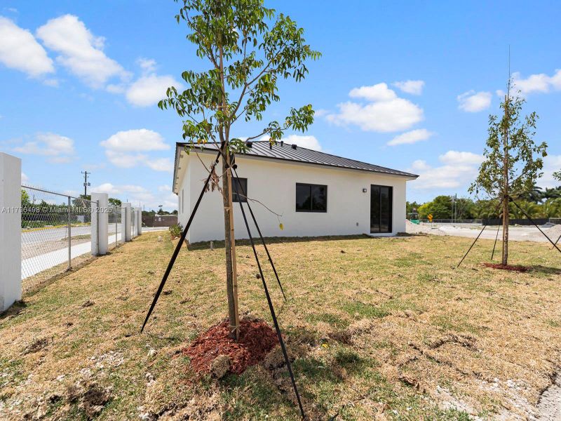 Front exterior of a new home in , Homestead, FL, highlighting curb appeal (Image 18).