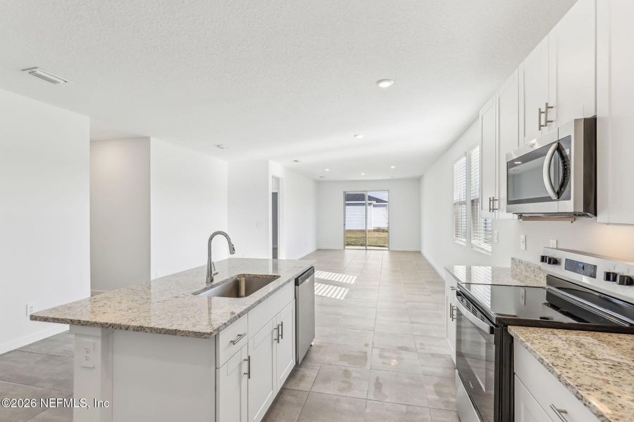 Furnished interior view inside a new home in Lakes at Bella Lago - Signature Series, Green Cove Springs (Image 11). Furnished interior view inside a new home in Lakes at Bella Lago - Signature Series, Green Cove Springs (Image 11).