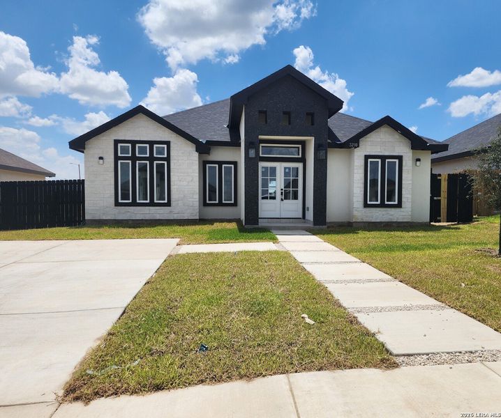 Front exterior of a new home in , Eagle Pass, TX, highlighting curb appeal (Image 1). Front exterior of a new home in , Eagle Pass, TX, highlighting curb appeal (Image 1).